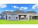 Home features a private covered patio and grassy backyard at 614 Castle Ct., Myrtle Beach, SC 29579
