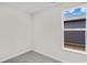 Simple bedroom with gray carpeting and a window offering natural light at 614 Castle Ct., Myrtle Beach, SC 29579