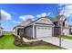 Gray two-car garage and charming craftsman style home exterior at 614 Castle Ct., Myrtle Beach, SC 29579