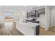 Modern kitchen with gray cabinets, quartz countertops, and stainless steel appliances at 614 Castle Ct., Myrtle Beach, SC 29579