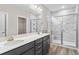 Double vanity bathroom with gray tile shower and modern fixtures at 297 Broughton Dr., Myrtle Beach, SC 29579