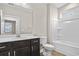 Bathroom with dark vanity, white tub, and vinyl flooring at 297 Broughton Dr., Myrtle Beach, SC 29579