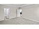 Bright bedroom with carpet, access to bathroom, and views of kitchen at 297 Broughton Dr., Myrtle Beach, SC 29579