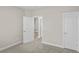 Spacious bedroom with neutral walls and carpet flooring, and access to other rooms at 297 Broughton Dr., Myrtle Beach, SC 29579