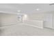 Large bonus room featuring carpet, multiple windows, and a private door at 297 Broughton Dr., Myrtle Beach, SC 29579