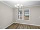 Bright dining room with hardwood floors and a chandelier at 297 Broughton Dr., Myrtle Beach, SC 29579