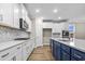 Modern kitchen with white cabinets, stainless steel appliances, and a large island at 297 Broughton Dr., Myrtle Beach, SC 29579