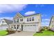 Two-story house with gray and white siding, landscaping, and two-car garage at 315 Broughton Dr., Myrtle Beach, SC 29579