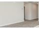 Bright living room with grey vinyl plank flooring and neutral walls at 1932 Whispering Pine St., Ocean Isle Beach, NC 28469