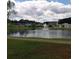 Community pond with fountain and surrounding homes at 173 Rocko Dr., Myrtle Beach, SC 29579