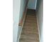 Carpeted staircase with wooden handrail at 173 Rocko Dr., Myrtle Beach, SC 29579