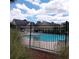 Community swimming pool with surrounding fence and lounge chairs at 173 Rocko Dr., Myrtle Beach, SC 29579