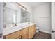 Double vanity bathroom with wood cabinets and a large mirror at 268 Maple Oak Dr., Conway, SC 29526