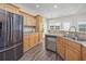 Open concept kitchen with stainless steel appliances and granite counters at 268 Maple Oak Dr., Conway, SC 29526