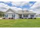 One-story house with gray siding, blue shutters, and a well-manicured lawn at 268 Maple Oak Dr., Conway, SC 29526