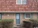 Brick building with a gray door and green shutters at 1025 Carolina Rd. # M-3, Conway, SC 29526