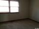 Simple bedroom with carpeted floors and window at 1025 Carolina Rd. # M-3, Conway, SC 29526