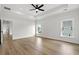 Light-filled bedroom with hardwood floors and ceiling fan at 946 Crystal Water Way, Myrtle Beach, SC 29579