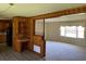 Bright dining room with built-in wooden shelving and hardwood floors at 4155 Pinewood Dr., Mullins, SC 29574