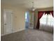 Bright bedroom with mirrored closet doors and ensuite bathroom access at 4155 Pinewood Dr., Mullins, SC 29574