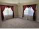Spacious bedroom with ample natural light and neutral carpeting at 4155 Pinewood Dr., Mullins, SC 29574