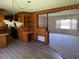 Kitchen with wood cabinets, laminate flooring, and a breakfast bar at 4155 Pinewood Dr., Mullins, SC 29574