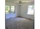Bright bedroom with carpet, large windows, and a ceiling fan at 4155 Pinewood Dr., Mullins, SC 29574