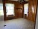 Bedroom with wood paneling, ceiling fan and carpet at 4155 Pinewood Dr., Mullins, SC 29574