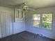 Bedroom with built-in shelves, window with yard view, and carpet at 4155 Pinewood Dr., Mullins, SC 29574