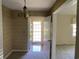 Entryway with patterned wallpaper and view to front door at 4155 Pinewood Dr., Mullins, SC 29574