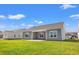 Gray home with covered patio and grassy backyard at 3409 Little Bay Dr., Conway, SC 29526