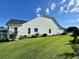 Side view of the house showcasing landscaping and exterior at 504 Windward Ct., Myrtle Beach, SC 29579