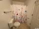 Bathroom with toilet and floral shower curtain at 59-2 Rye Grass Ln. # 2, Pawleys Island, SC 29585