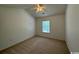 Bright bedroom with vaulted ceiling and carpet at 59-2 Rye Grass Ln. # 2, Pawleys Island, SC 29585