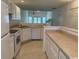 Kitchen with white cabinets, island, and breakfast bar at 59-2 Rye Grass Ln. # 2, Pawleys Island, SC 29585