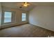 Large main bedroom with carpet and window seat at 59-2 Rye Grass Ln. # 2, Pawleys Island, SC 29585