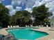 Community pool with lounge chairs and trees at 59-2 Rye Grass Ln. # 2, Pawleys Island, SC 29585