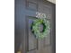 Dark-colored front door adorned with a spring wreath at 1525 Lanterns Rest Rd. # 203, Myrtle Beach, SC 29579