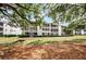 Building exterior surrounded by lush landscaping at 1525 Lanterns Rest Rd. # 203, Myrtle Beach, SC 29579