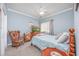 Cozy bedroom featuring a wood bed frame and a TV at 1525 Lanterns Rest Rd. # 203, Myrtle Beach, SC 29579