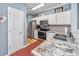 Updated kitchen featuring granite countertops and stainless steel appliances at 1525 Lanterns Rest Rd. # 203, Myrtle Beach, SC 29579