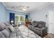 Spacious living room with comfortable sofas and sliding glass doors to patio at 1525 Lanterns Rest Rd. # 203, Myrtle Beach, SC 29579