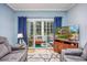 Living area with comfortable seating and access to private patio at 1525 Lanterns Rest Rd. # 203, Myrtle Beach, SC 29579