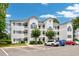 Three-story building with ample parking and landscaping at 1525 Lanterns Rest Rd. # 203, Myrtle Beach, SC 29579
