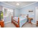 Charming bedroom with a wood bed frame and window at 1525 Lanterns Rest Rd. # 203, Myrtle Beach, SC 29579