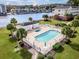 Community pool with patio furniture and nearby restrooms at 1525 Lanterns Rest Rd. # 203, Myrtle Beach, SC 29579
