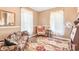 Sitting room with floral couch and patterned rug at 406 N Nichols St., Nichols, SC 29581