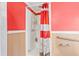 Small shower stall with red and white shower curtain at 406 N Nichols St., Nichols, SC 29581