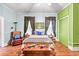 Spacious bedroom with a comfortable bed and leather armchair at 406 N Nichols St., Nichols, SC 29581