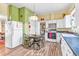 Kitchen with white cabinets, wood flooring, and a breakfast nook at 406 N Nichols St., Nichols, SC 29581
